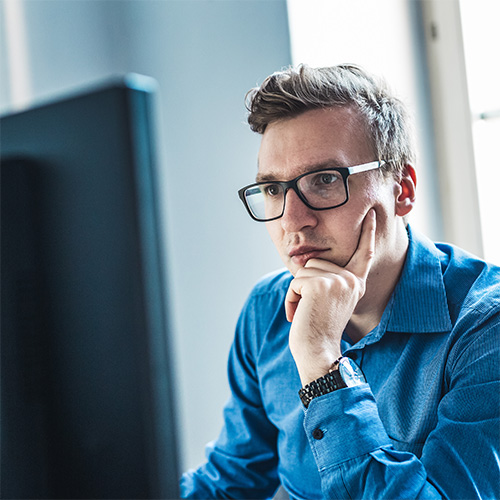 man concentrating on computer